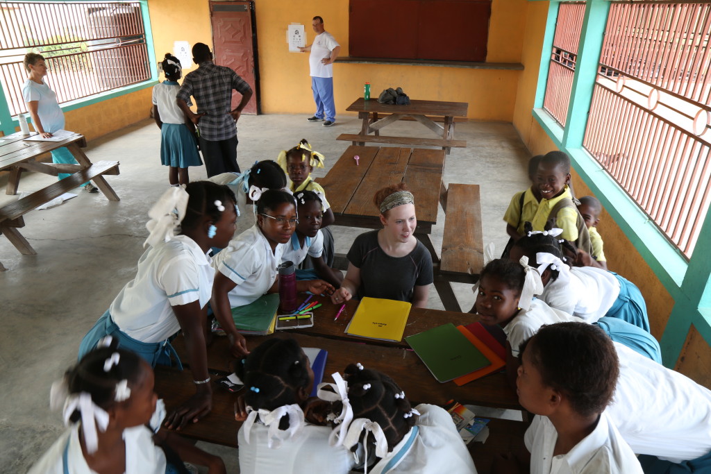 Alitza at the school, surrounded by students!